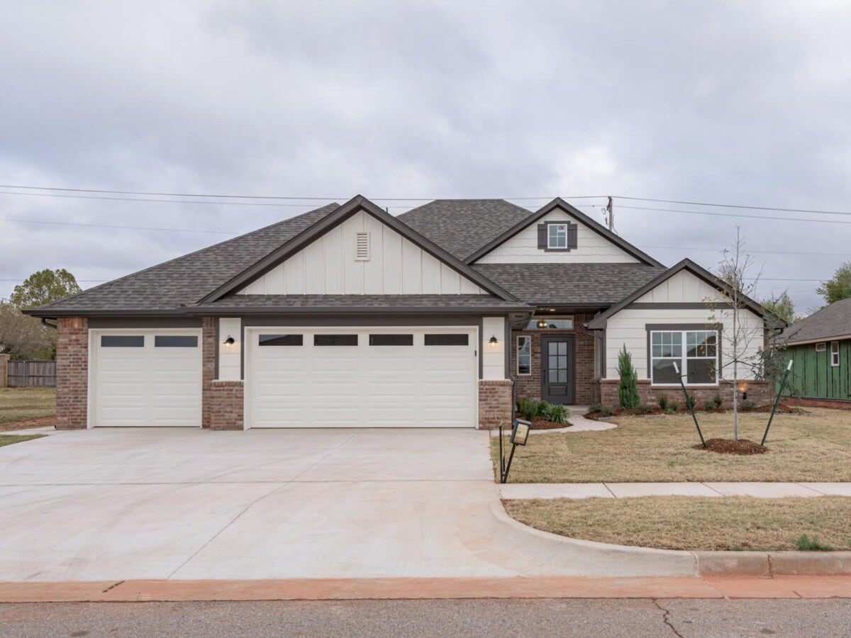 A home with a driveway and garage in the front yard