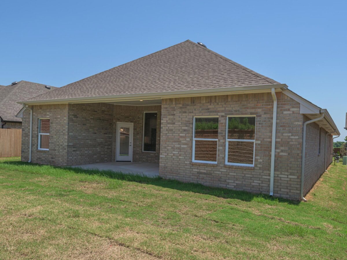 A brick house with a roof