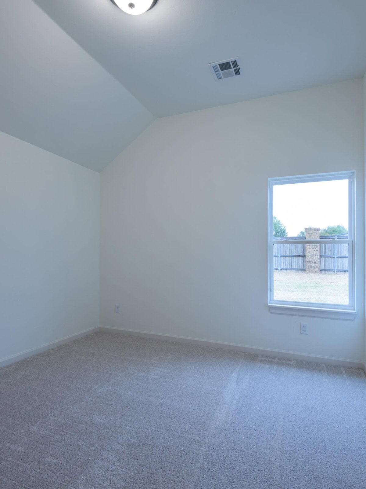 Empty room with carpet and window