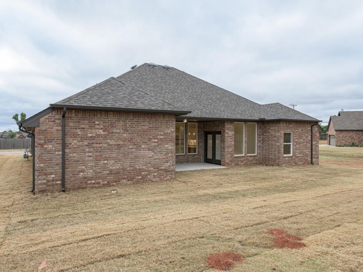 A brick house with a roof