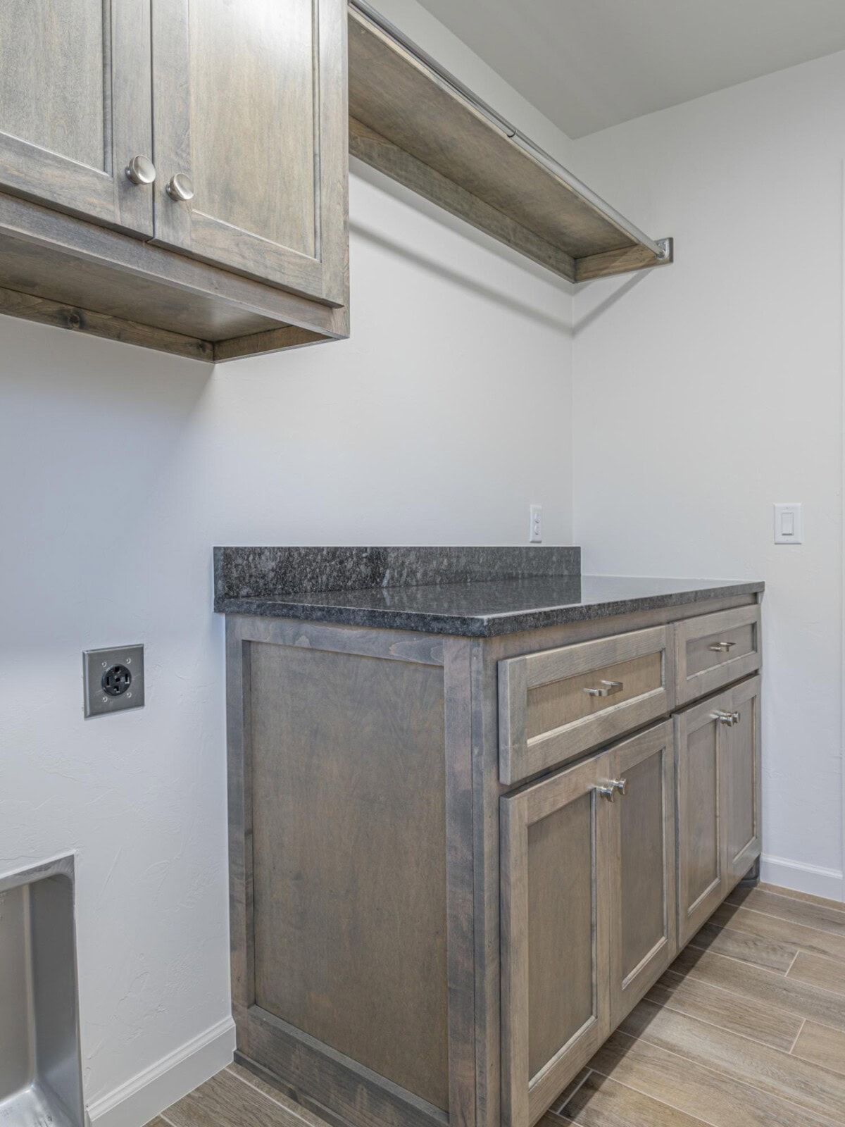 A kitchen with a sink and cabinets