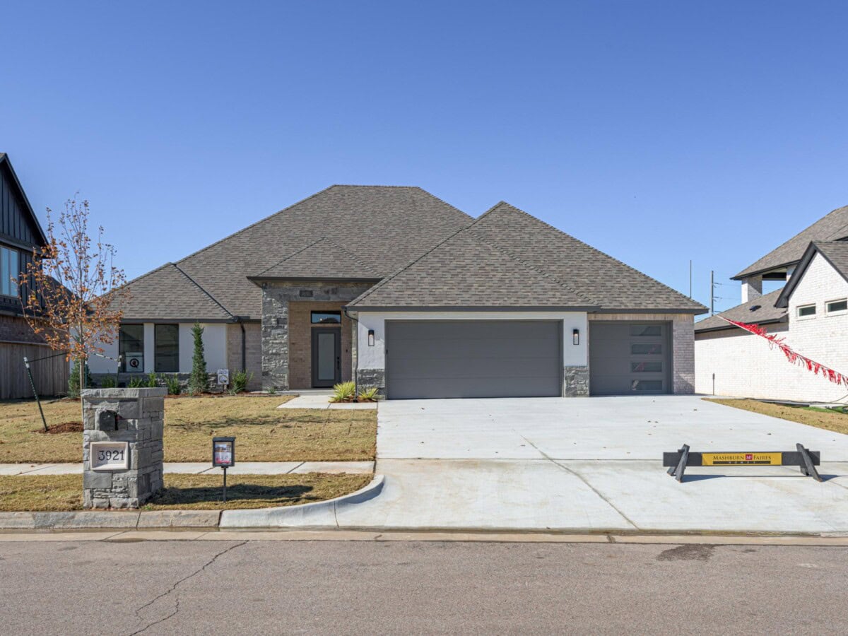 A large house with a garage and a driveway