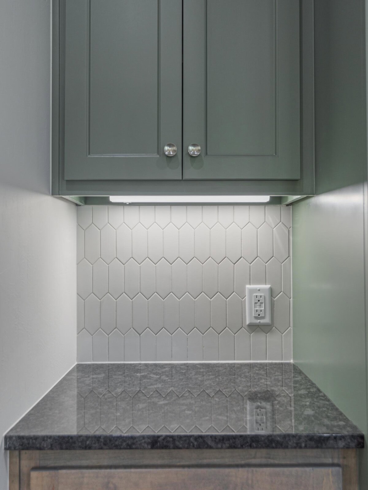 A kitchen with a sink and cabinets