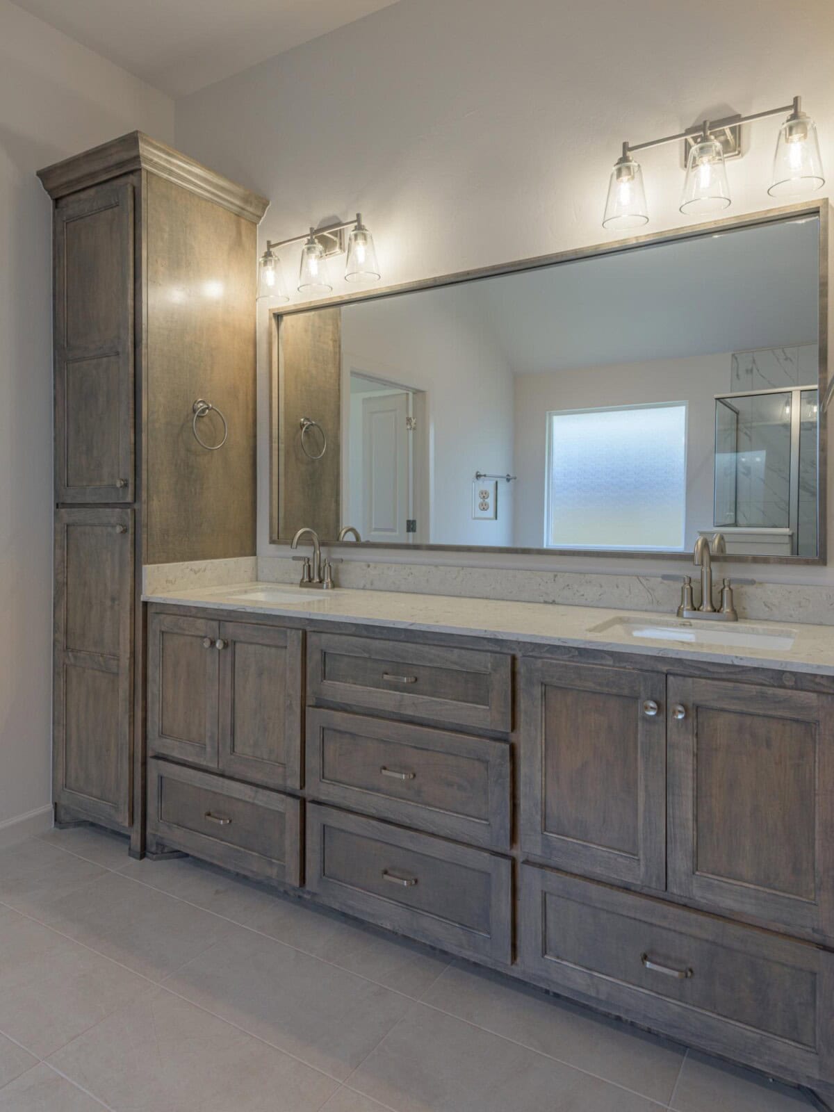 A large bathroom with a large vanity and two sinks