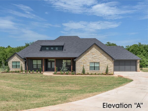 A home with a large garage and a large driveway
