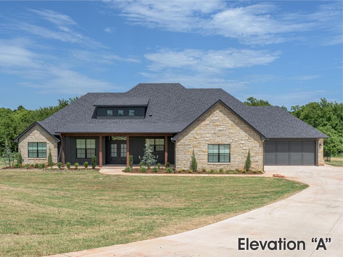 A home with a large garage and a large driveway