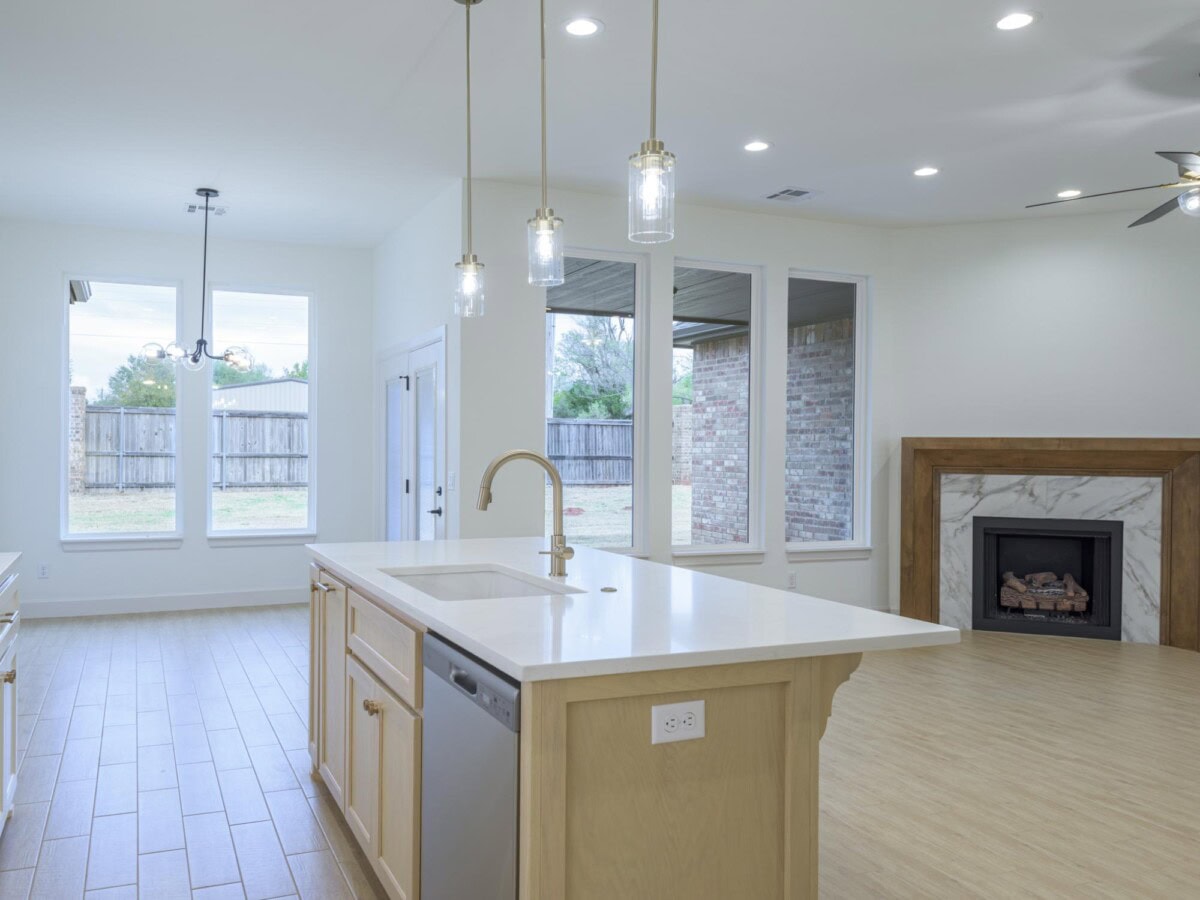 A kitchen with a stove and sink