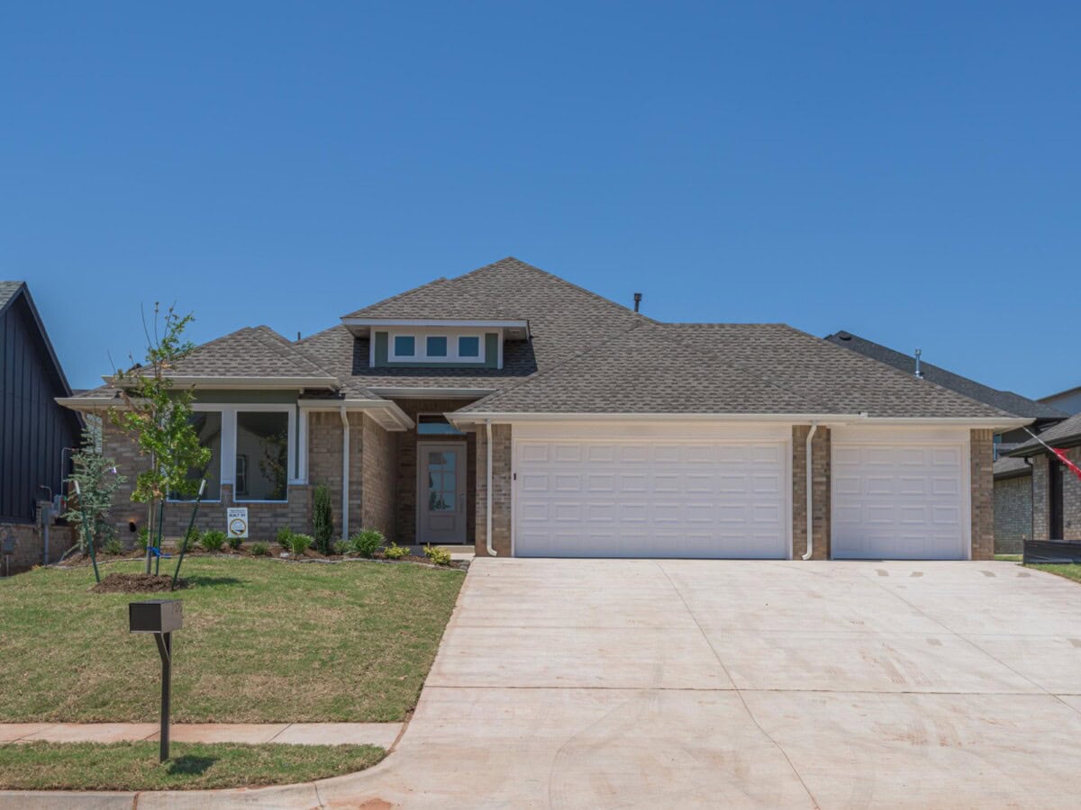 A large house with a driveway and a garage