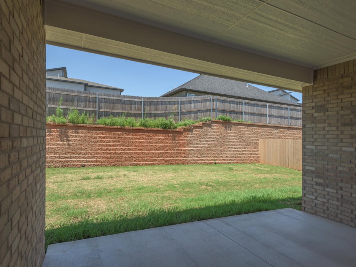 A view of a backyard from inside a house
