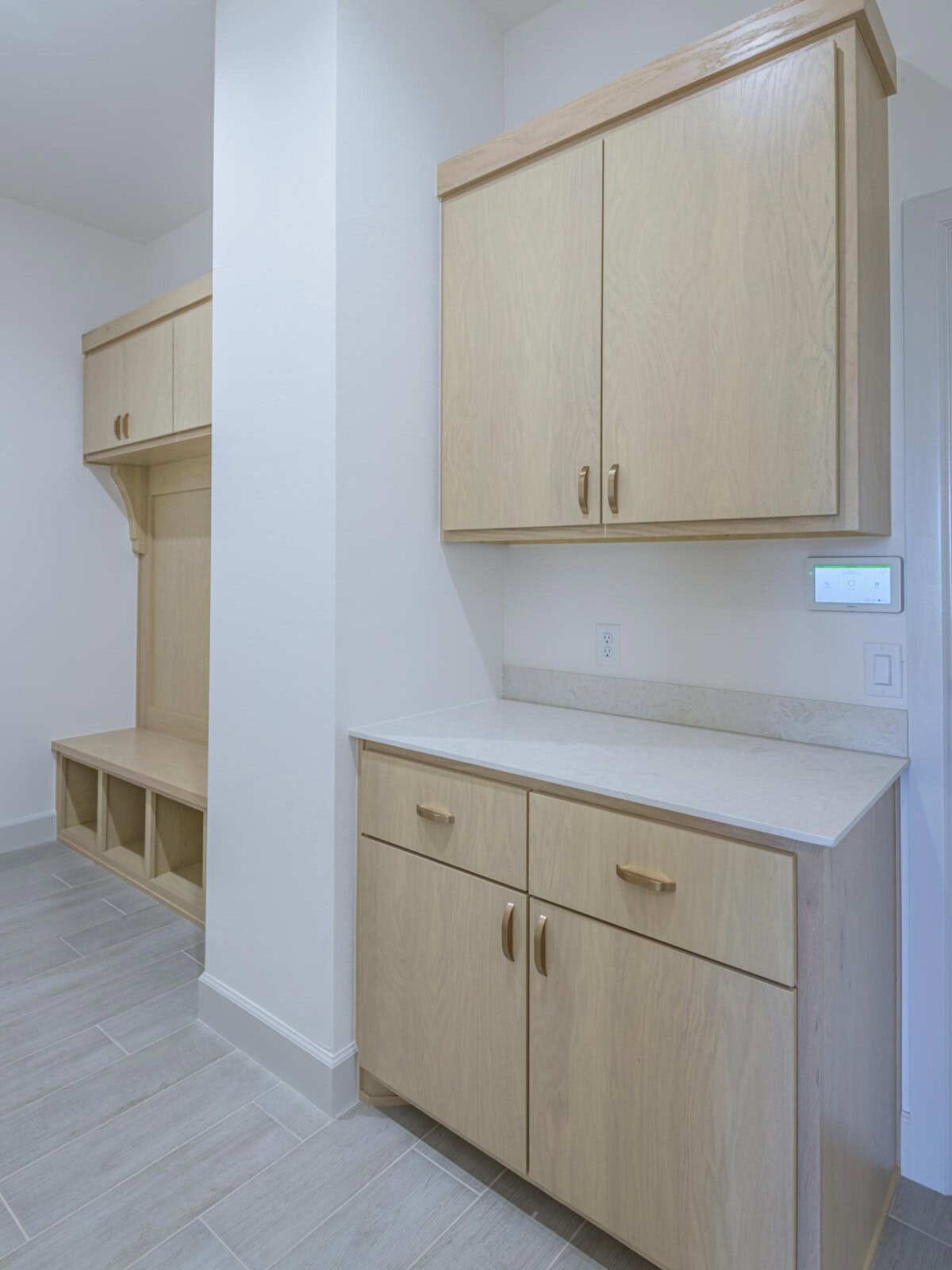A kitchen with cabinets and a bench